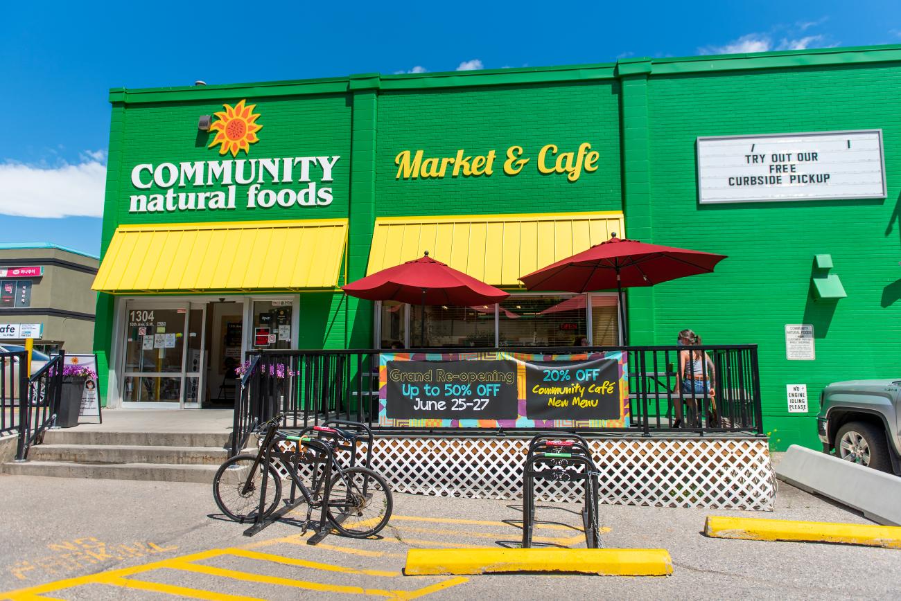 The exterior of Community Natural Foods renovated location including an outdoor cafe